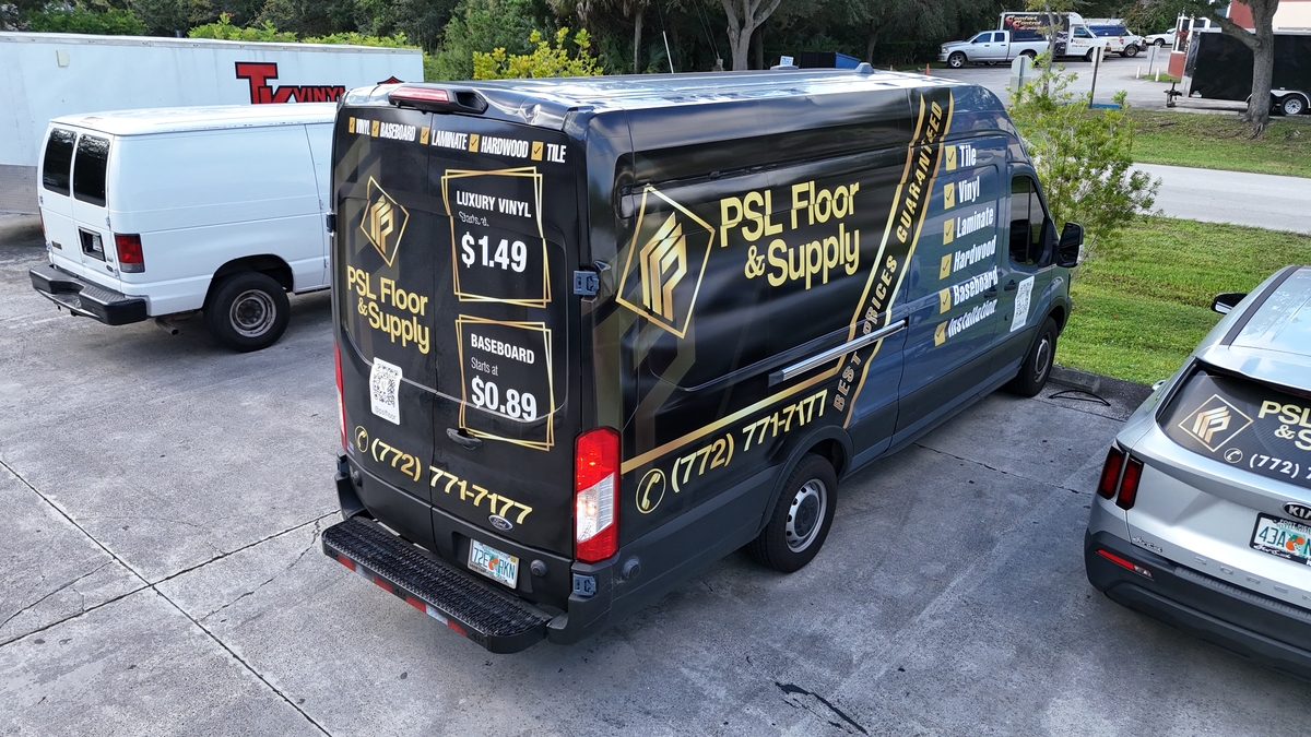 A stunningly renovated modern kitchen in a Port Saint Lucie, FL home, showcasing high-quality flooring from PSL Floor & Supply.