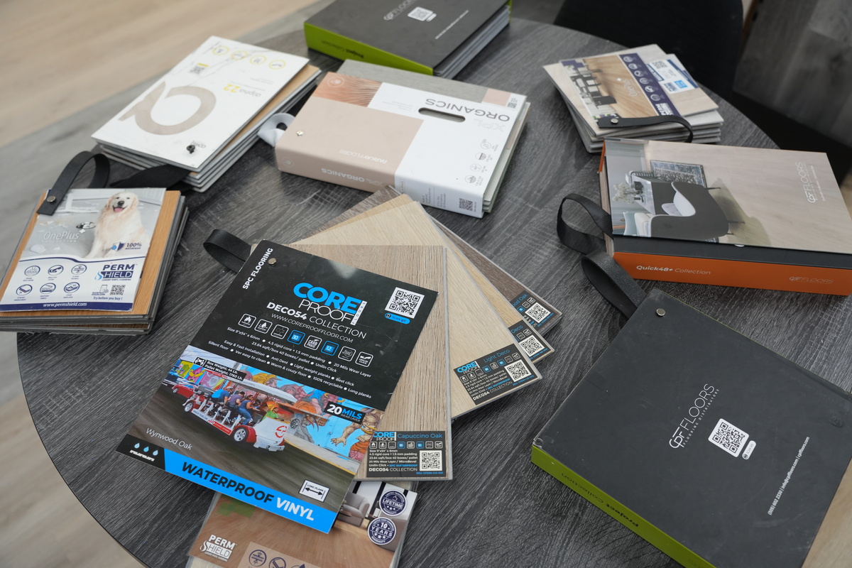 A bright living room in Port St. Lucie with durable and affordable light oak luxury vinyl plank flooring from PSL Floor & Supply.