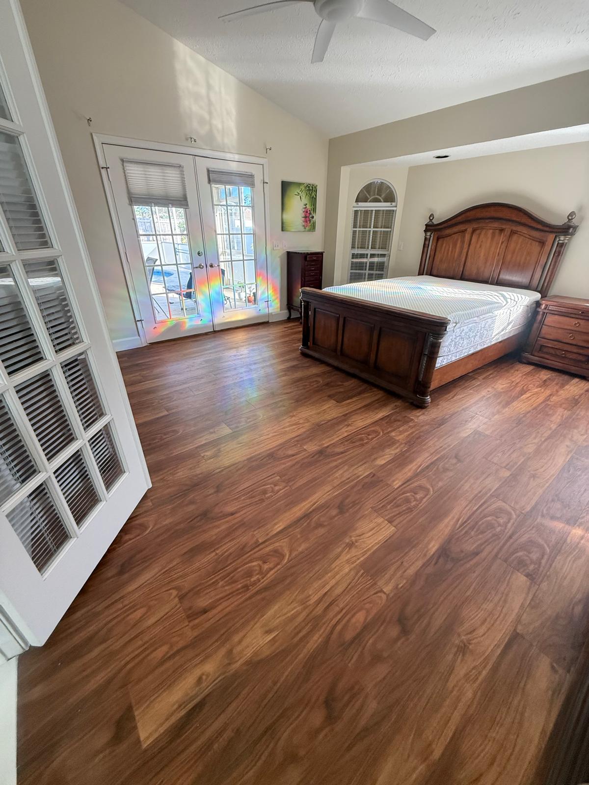 Bright living room with large grey porcelain tile flooring installed by PSL Floor & Supply.