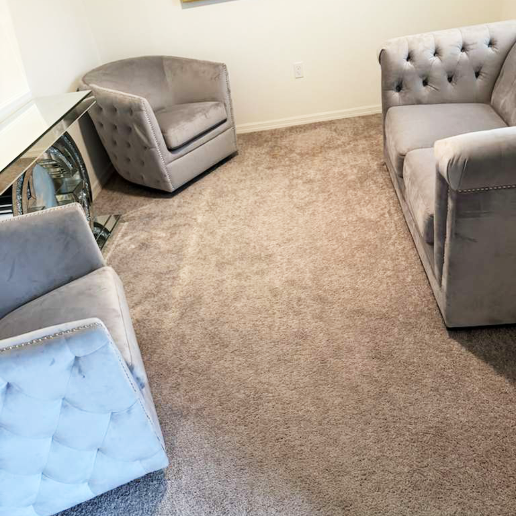 Living room carpet before upgrade Old grey carpet in a living room before flooring renovation