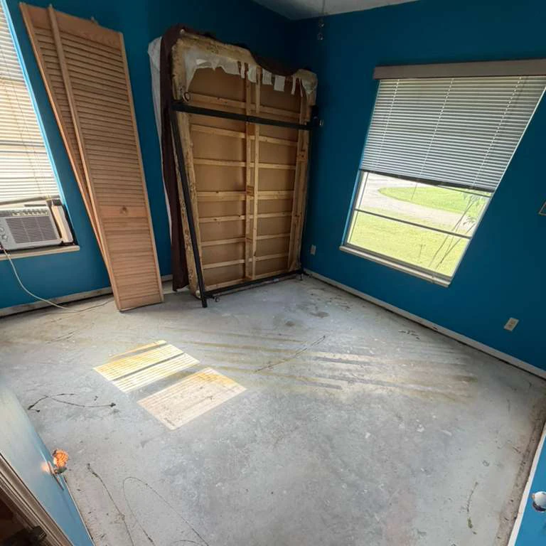 Bedroom Floor Preparation Before Vinyl Flooring Installation Bedroom with exposed concrete subfloor before luxury vinyl plank flooring installation