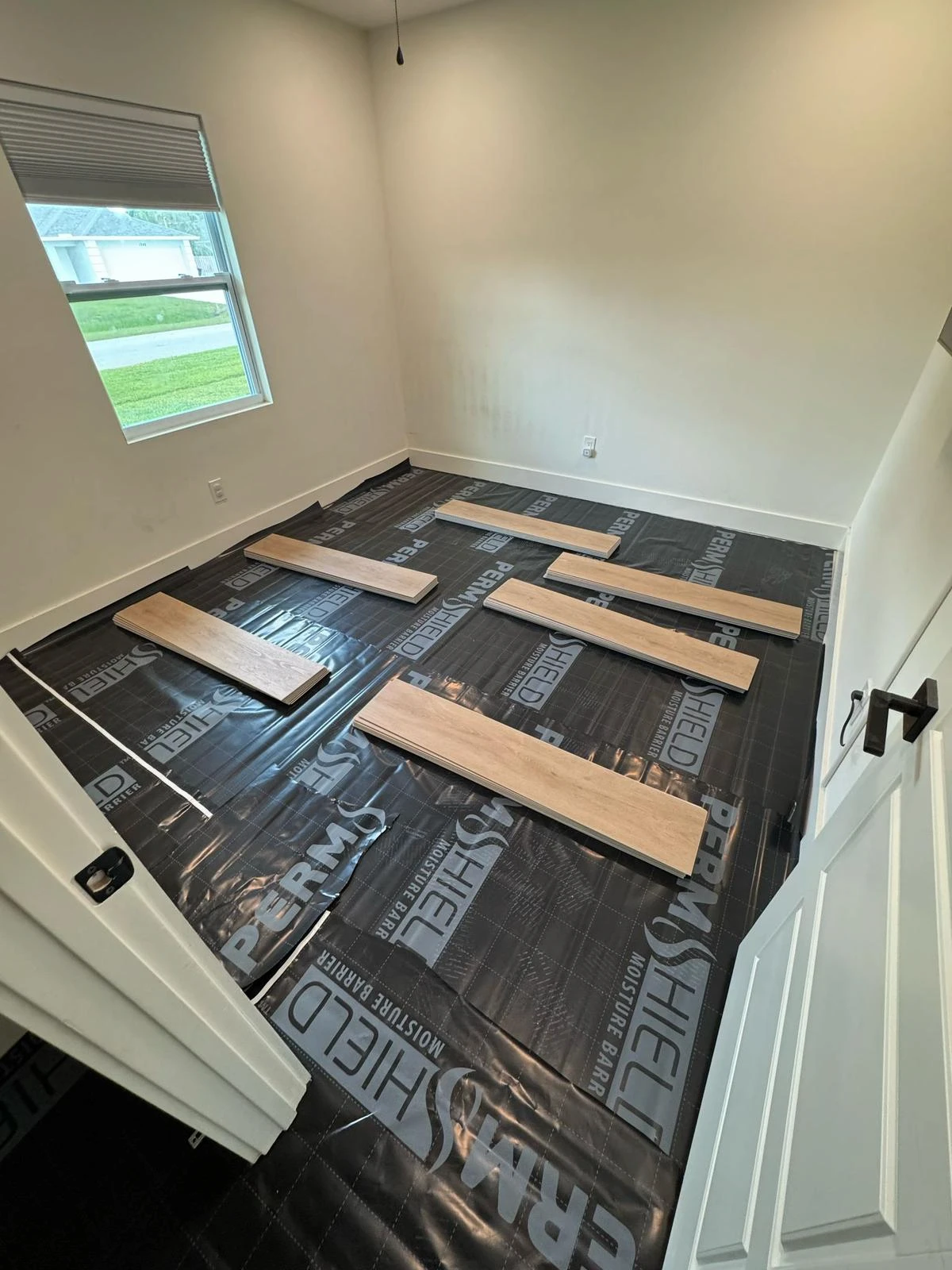 Damaged hardwood floor being assessed for repair in a Port St. Lucie home — PSL Floor & Supply provides professional floor repair near me on the Treasure Coast