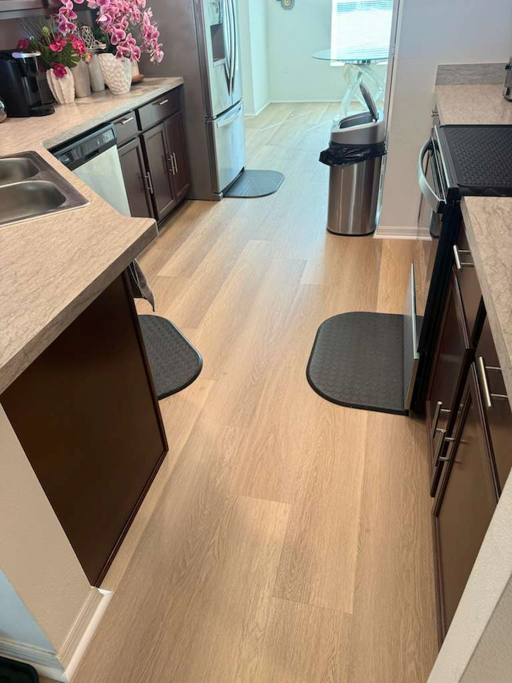 Kitchen flooring options at PSL Floor & Supply — tile and waterproof vinyl plank installed in a Port St. Lucie kitchen
